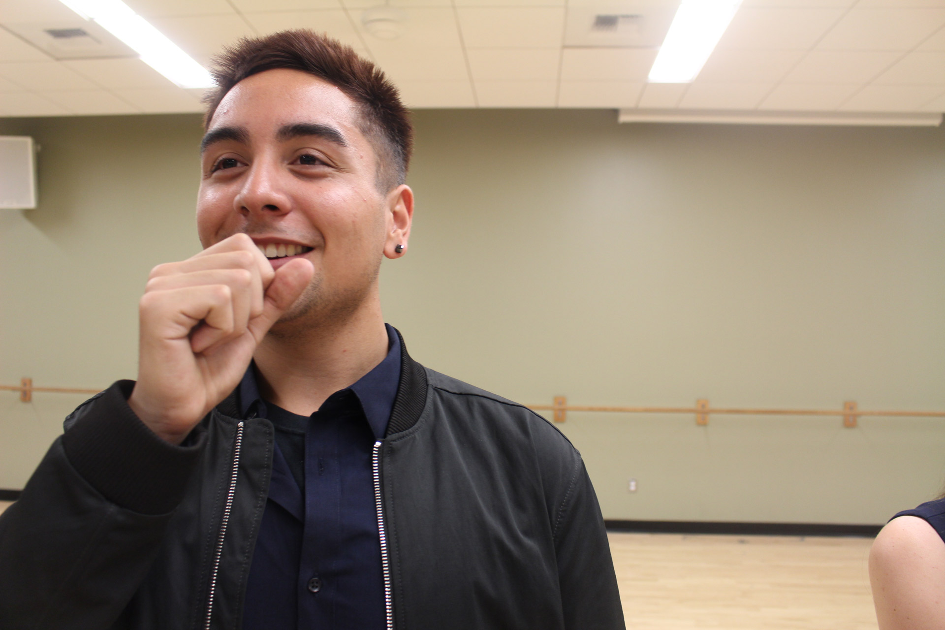 Standout songster- English junior Jared Noche creates an improvised microphone with his first to replicate a stage environment. Although it is his first year in the group, he was selected to be one of two soloists for the first round of the competition. San Luis Obispo, Calif., Monday, January 30, 2017.